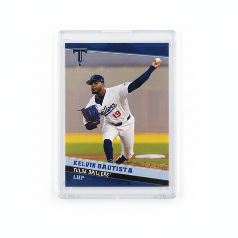 Baseball trading card of Kelvin Bautista on a speckled gray surface